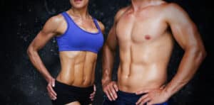 Bodybuilding couple against black background